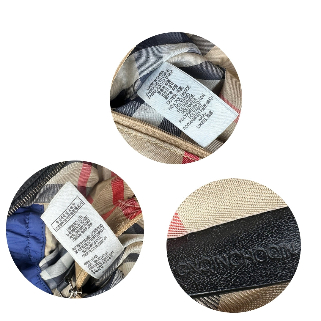 Codice seriale ed etichette della shopper Burberry in nylon blu con finiture in pelle nera, da indossare a spalla. Rifinita con lacci laterali e parti metalliche argentate. Originale, usato, in buone condizioni, con lievi segni di utilizzo sul tessuto.