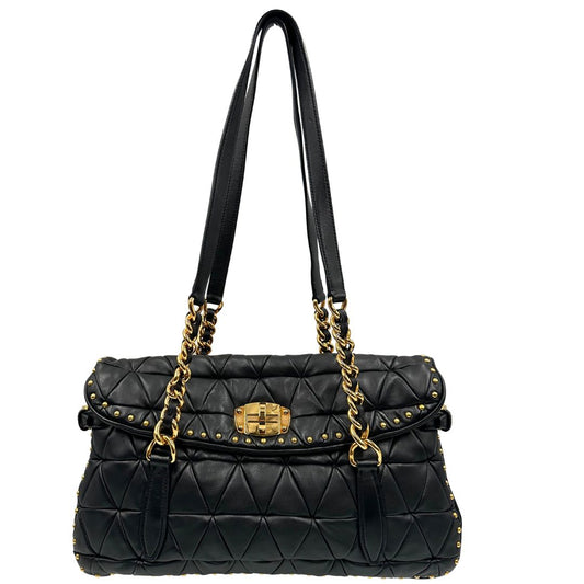 front Borsa Miu Miu in pelle nera, impreziosita da borchie dorate e doppi manici, di lusso, originale, ottime condizioni, usata.