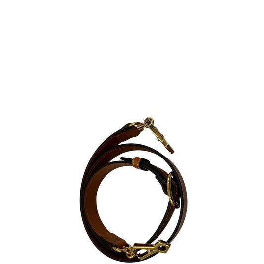 Tracolla Gucci in pelle color caramello e parti metalliche dorate.