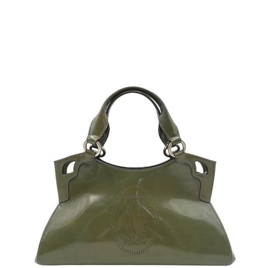 Borsa Cartier Marcello in pelle verniciata verde oliva con parti metalliche argento opaco. Munita di doppi manici e rifinita con logo forato sul front. Completa di dustbag. Originale, usato, in condizioni ottime.