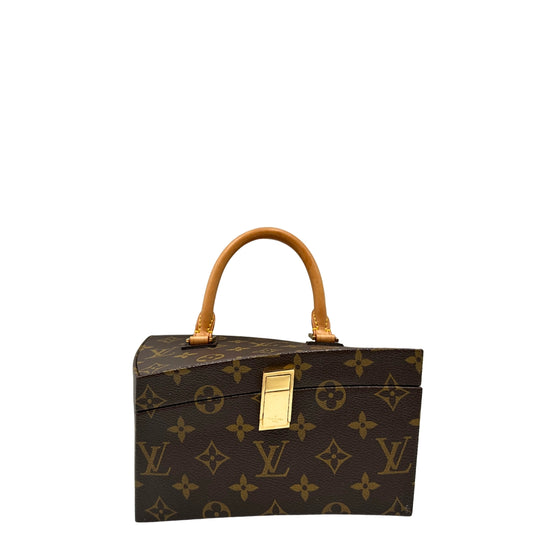 Tote Twisted Box Louis Vuitton x Frank Gehry in canvas marrone monogram con finiture in vacchetta naturale e parti metalliche dorate. Completo di corredo. Originale, usato, in condizioni ottime.
