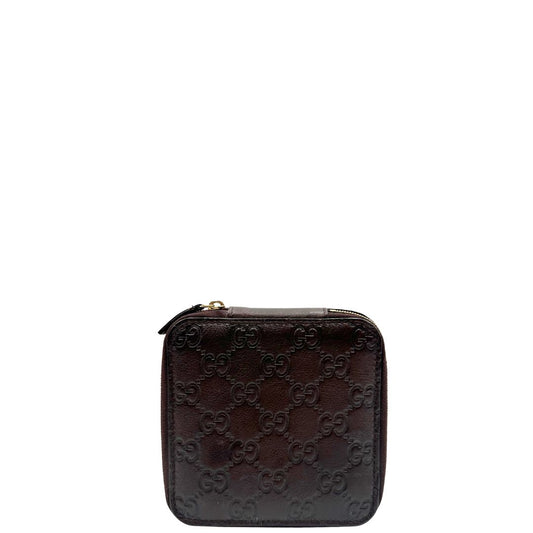 Portagioie Gucci in pelle marrone testa di moro con trama GG e parti metalliche dorate. Completo di dustbag. Originale, usato, in condizioni ottime.