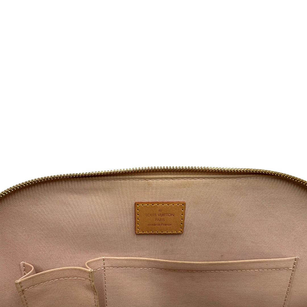 Interno Alma PM Louis Vuitton in pelle Vernis color noisette con parti metalliche dorate e doppi manici stondati; da portare a mano. Originale, usato, in condizioni ottime.