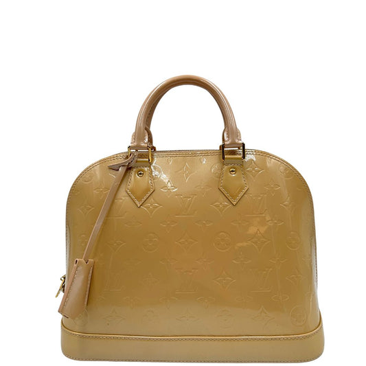 Alma PM Louis Vuitton in pelle Vernis color noisette con parti metalliche dorate e doppi manici stondati; da portare a mano. Originale, usato, in condizioni ottime.