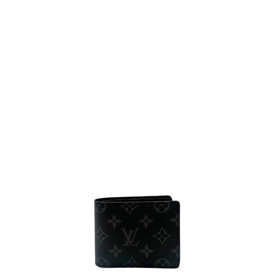Portafoglio Louis Vuitton Slender in in tela nera Monogram Eclipse, munito di vari scomparti. Completo di corredo. Originale, usato, in condizioni eccellenti.