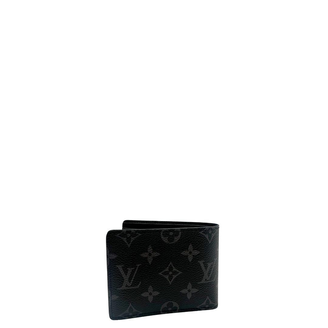 Portafoglio Louis Vuitton Slender in in tela nera Monogram Eclipse, munito di vari scomparti. Completo di corredo. Originale, usato, in condizioni eccellenti. (personalizzato con iniziali all'interno A.C)