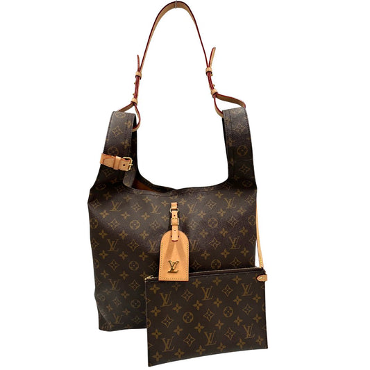 front Borsa Louis Vuitton in canvas marrone monogram con finiture in vacchetta naturale e parti metalliche dorate; munita di doppi manici, una tracolla e una pochette interna estraibile. Completa di dustbag, di lusso, originale, ottime condizioni.