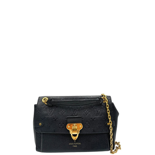 Front di una una borsa Louis Vuitton in pelle blu notte Monogram Empreinte, con parti metalliche dorate; munita di una tracolla scorrevole con spallacci in pelle. Completa di scatola.