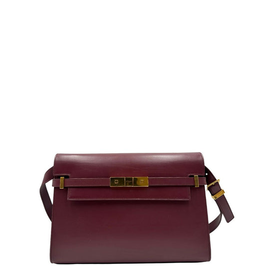 Borsa Saint Laurent Manhattan in pelle bordeaux e hardware dorato, da portare a spalla.