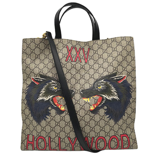Borsa Gucci in canvas GG Supreme con parti metalliche dorate e finiture in pelle nera; munita di doppi manici stondati e una tracolla amovibile. Completa di dustbag