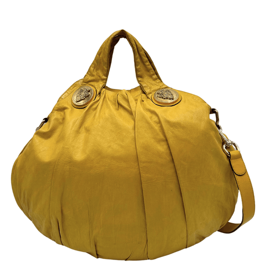 Borsa Gucci in pelle gialla con parti metalliche dorate, munita di doppi manici con stemma Hysteria in metallo e una tracolla amovibile