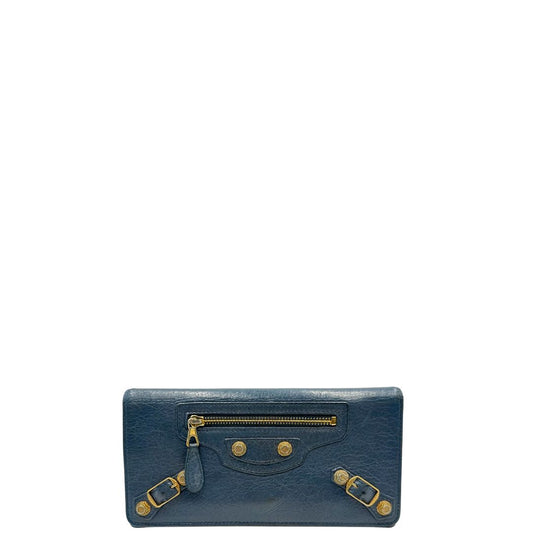 Front di un Portafoglio Balenciaga in pelle crinkled blu polveroso con parti metalliche dorate. Completa di dustbag. Originale, usato, di lusso, in ottime condizioni.