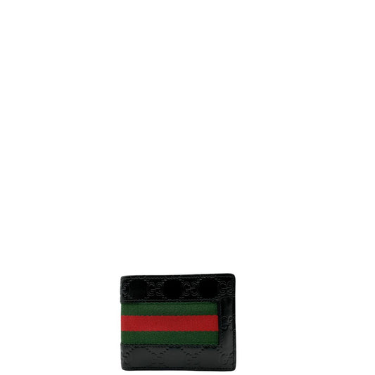 Front di un Portafoglio Gucci pelle nera GG impreziosito da striscia Web verde e rossa. Completo di scatola e dustbag. Originale, usata, di lusso, in ottime condizioni.
