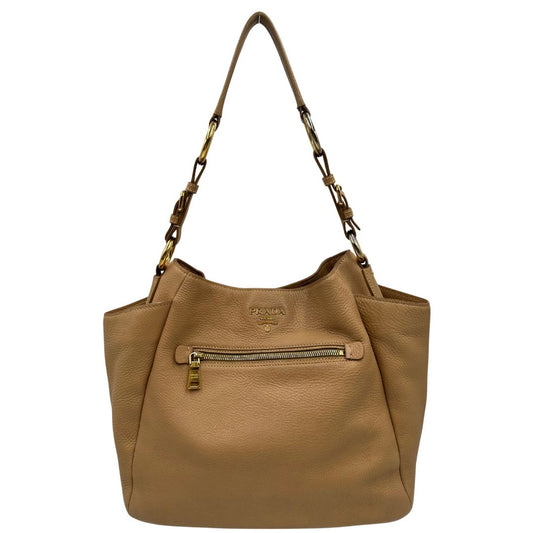 front Borsa Prada in pelle martellata beige e parti metalliche dorate; munitra di un manico singolo, indossabile a spalla. Completa di dustbag, di lusso, originale, ottime condizioni.