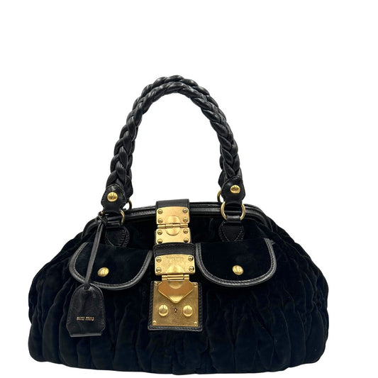 front Borsa Miu Miu in velluto nero con finiture in pelle tono su tono e parti metalliche dorate; munita di doppi manici intrecciati, di lusso, originale, ottime condizioni, usata.