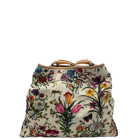 front Borsa Gucci in tessuto bianco con ricami floreali multicolor, finiture in pelle rosa e parti metalliche dorate; munita di un manico singolo. Completa di dustbag, di lusso, originale, ottime condizioni.