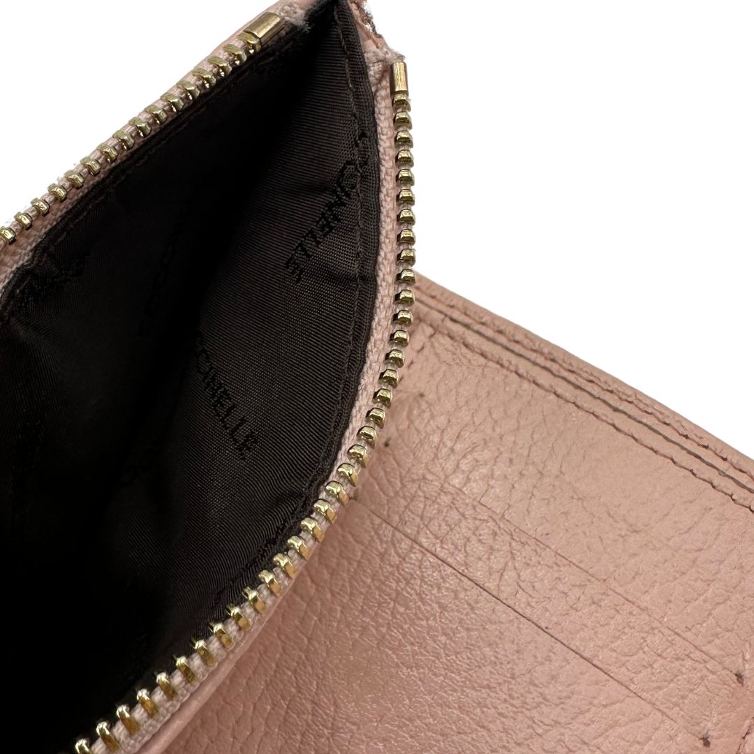 Portafoglio Coccinelle in pelle martellata rosa, di lusso, originale, ottime condizioni, usato.