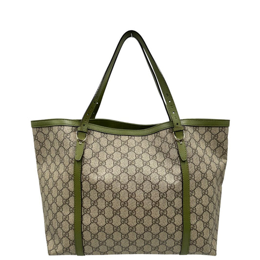Front, Borsa Gucci con finiture in canvas beige e finiture in pelle verde salvia. Indossabile a spalla. Originale, usata, di lusso, in ottime condizioni.