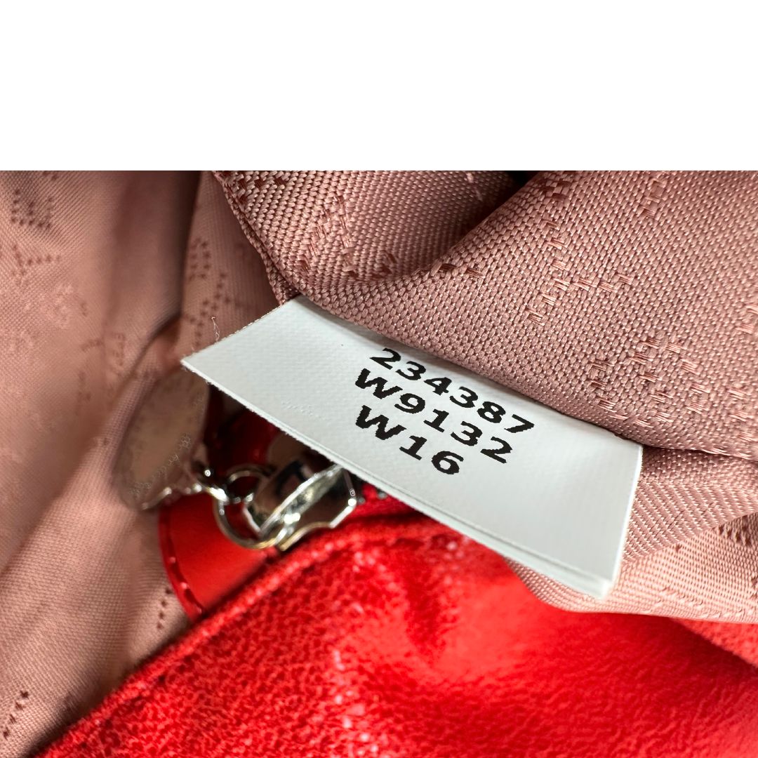 Borsa Falabella nella versione fold over tote in shaggy dear rosso e hardware argentato, di lusso, originale, ottime condizioni.