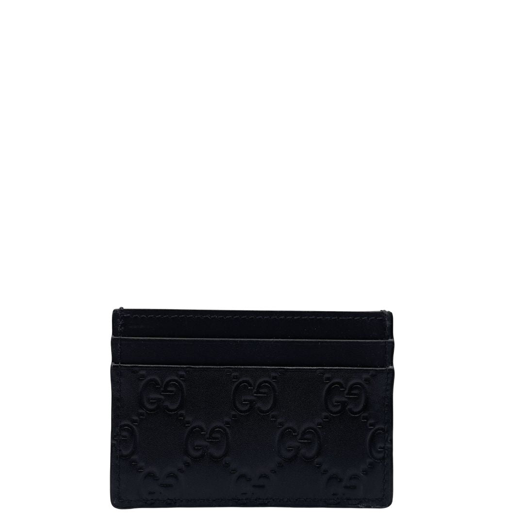 Portacarte Gucci GG in pelle nera trama Guccissima. 