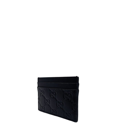 Portacarte Gucci GG in pelle nera trama Guccissima. 