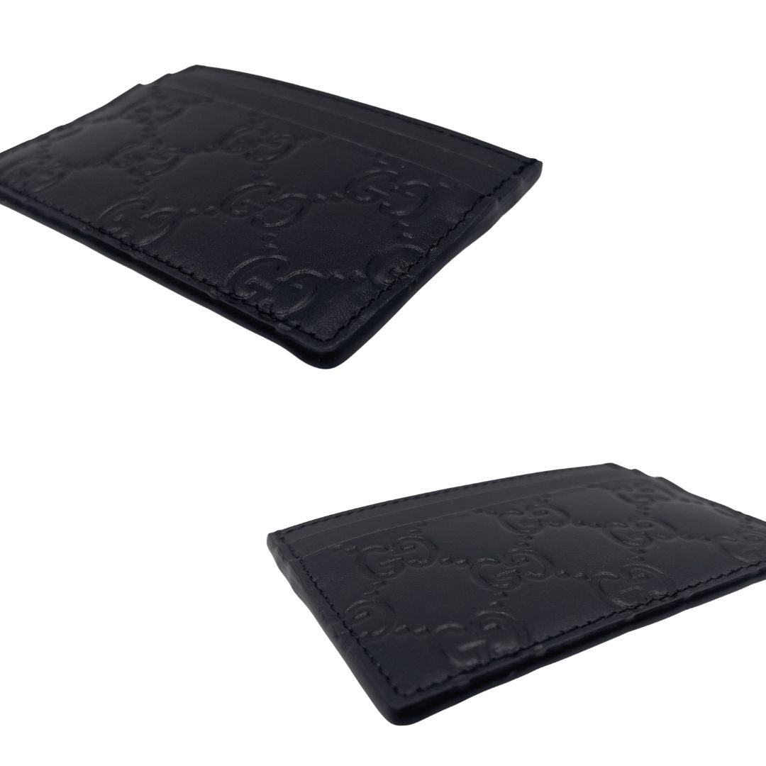 Portacarte Gucci GG in pelle nera trama Guccissima. 