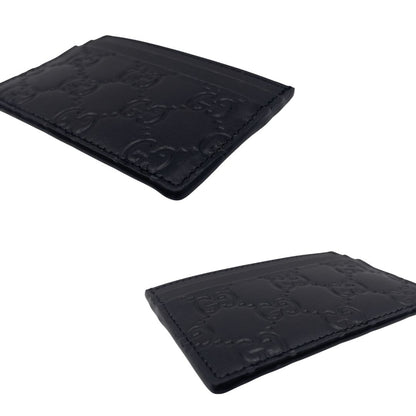 Portacarte Gucci GG in pelle nera trama Guccissima. 