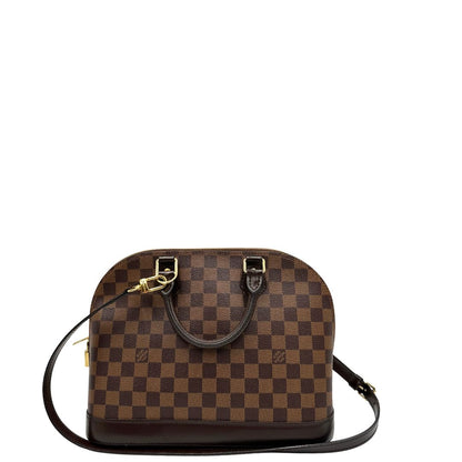 Retro, Strutturata borsa Alma PM LV in canvas Damier Ébène e hardware dorato, indossabile a mano oppure a tracolla.