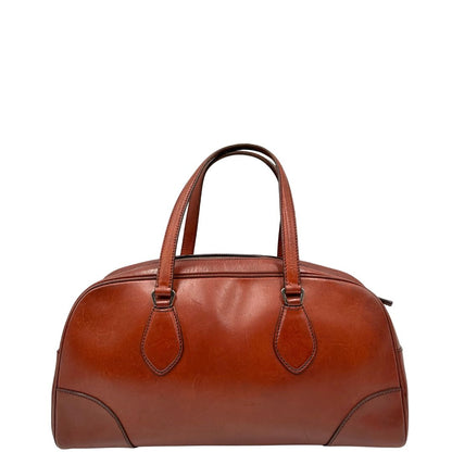 retro Borsa Prada in pelle color terracotta con parti metalliche argentate; munita di doppi manici. Completa di dustbag, lucchetto e chiavi, di lusso, originale, ottime condizioni. 