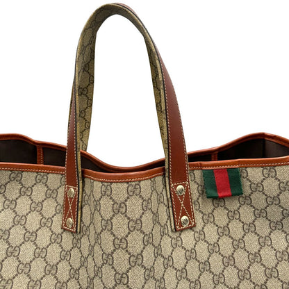 manici Tote Gucci in canvas GG beige con profili in pelle marrone e dettaglio Web verde e rosso, munita di doppi manici, indossabile a spalla, di lusso, originale, ottime condizioni. 