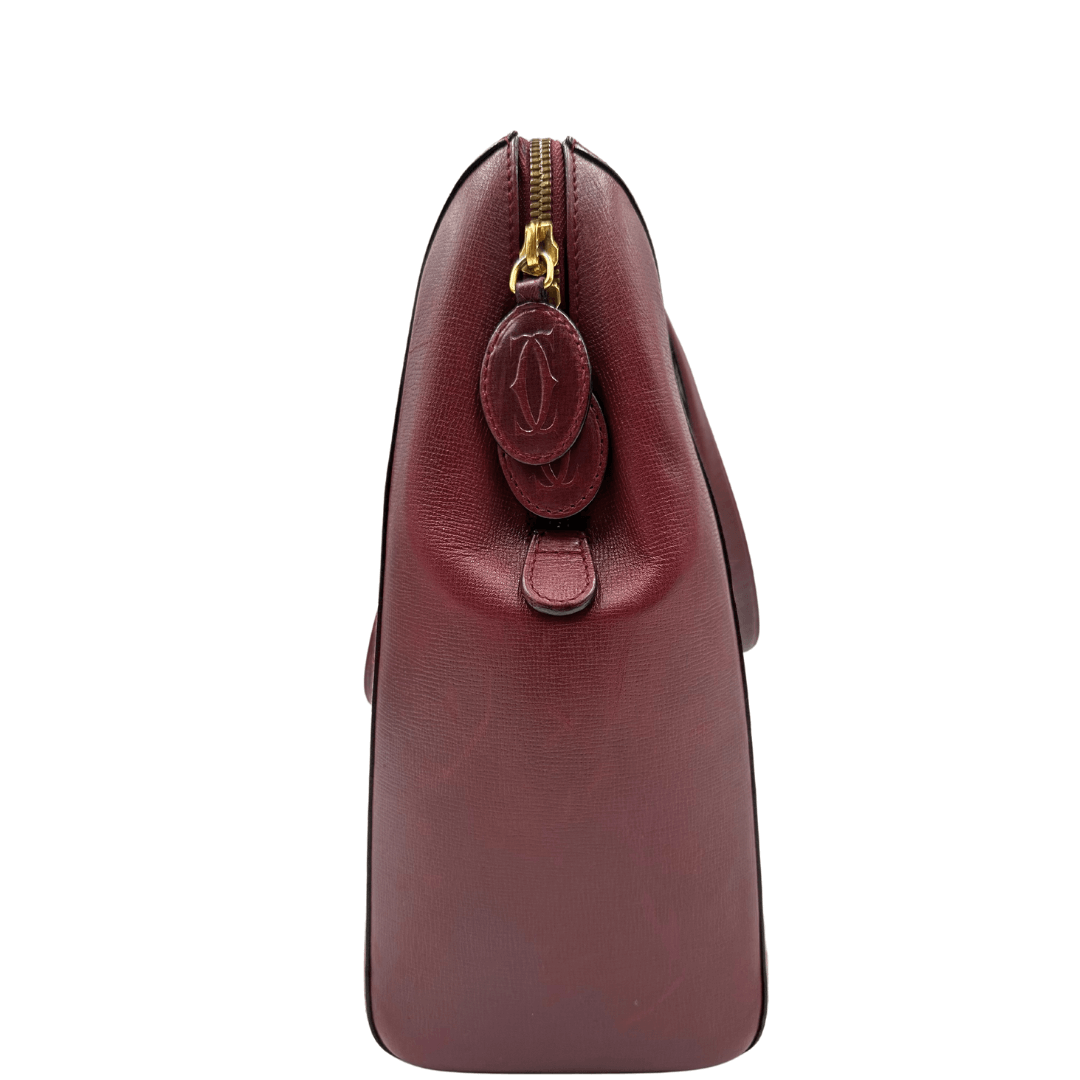 Borsa a spalla Cartier in pelle bordeaux. Borse di lusso originali, usate