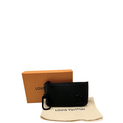 Pochette Clé Louis Vuitton in pelle nera aerogram. Accessori di lusso usati ed originali