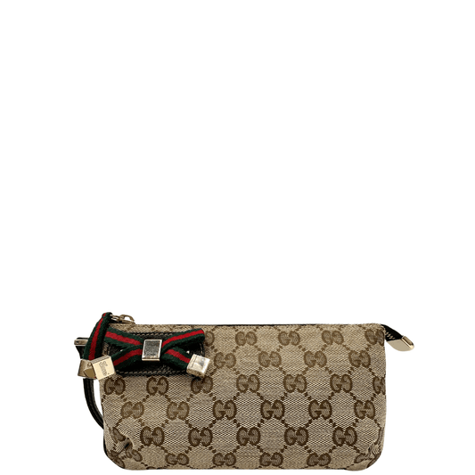 Pochette Gucci Princy in tela GG Supreme con fiocco Web verde e rosso. Un accessorio elegante e iconico, perfetto per aggiungere un tocco di stile al tuo look.