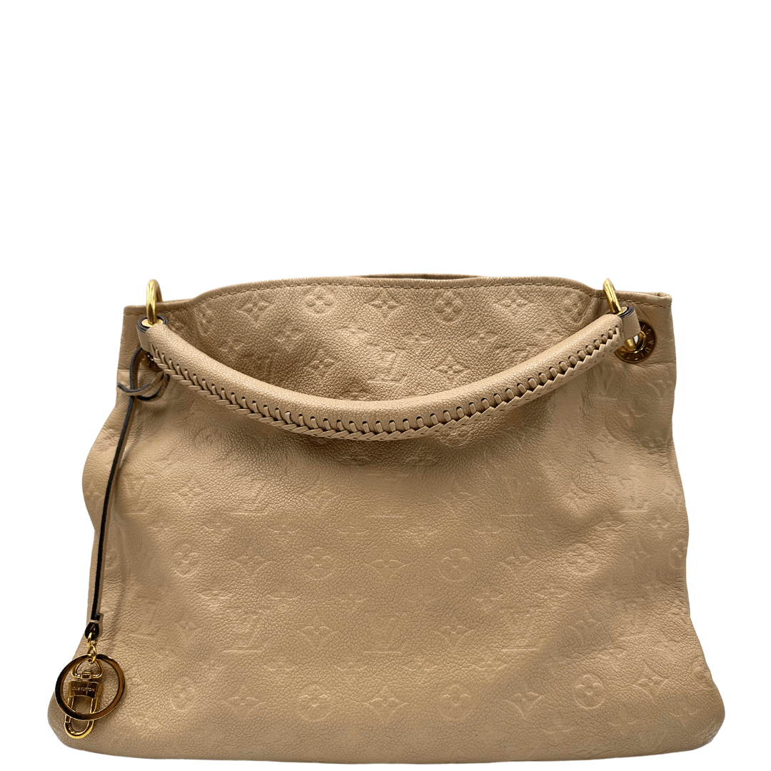 Louis Vuitton Artsy MM in pelle Monogram Empreinte beige. Elegante e spaziosa, con dettagli intrecciati e charm dorato. Perfetta per un look sofisticato.