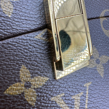 Tote Twisted Box Louis Vuitton x Frank Gehry in canvas marrone monogram con finiture in vacchetta naturale e parti metalliche dorate. Completo di corredo. Originale, usato, in condizioni ottime. 