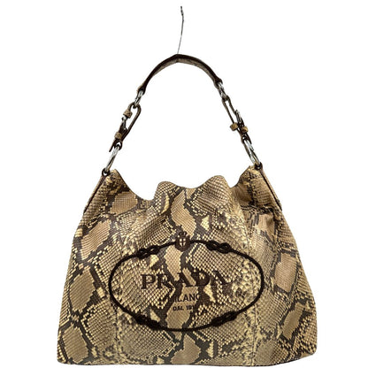 Borsa Prada in pelle con trama animalier rifinita con inserti metallici argentati e ricami marroni; munita di un manico singolo, da portare a spalla 