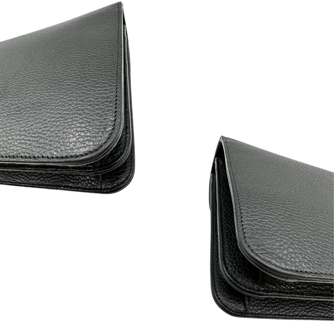 angoli Borsa Gucci in pelle martellata nera rifinita con inserti metallici dorati; munita di una tracolla in catena scorrevole con spallaccio in pelle 