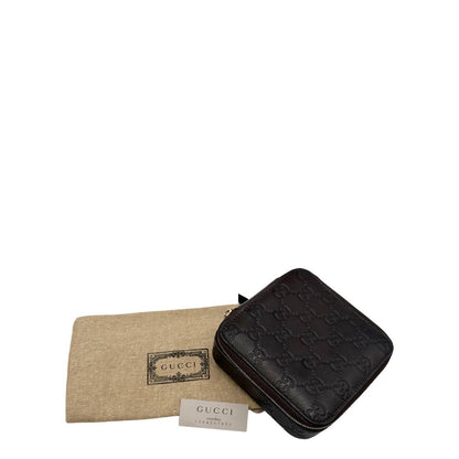 Portagioie Gucci in pelle marrone testa di moro con trama GG e parti metalliche dorate. Completo di dustbag. Originale, usato, in condizioni ottime. 