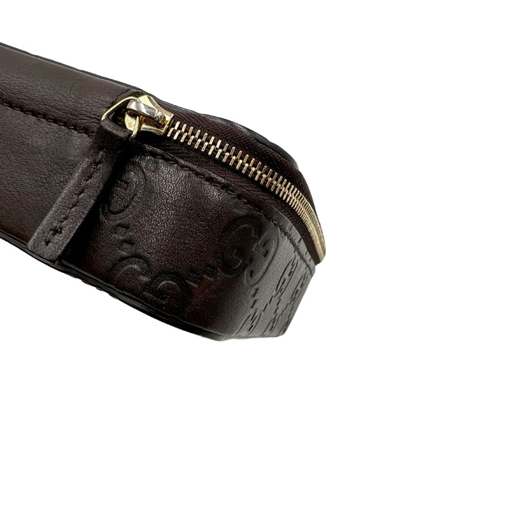 Portagioie Gucci in pelle marrone testa di moro con trama GG e parti metalliche dorate. Completo di dustbag. Originale, usato, in condizioni ottime. 