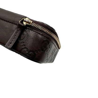 Portagioie Gucci in pelle marrone testa di moro con trama GG e parti metalliche dorate. Completo di dustbag. Originale, usato, in condizioni ottime. 