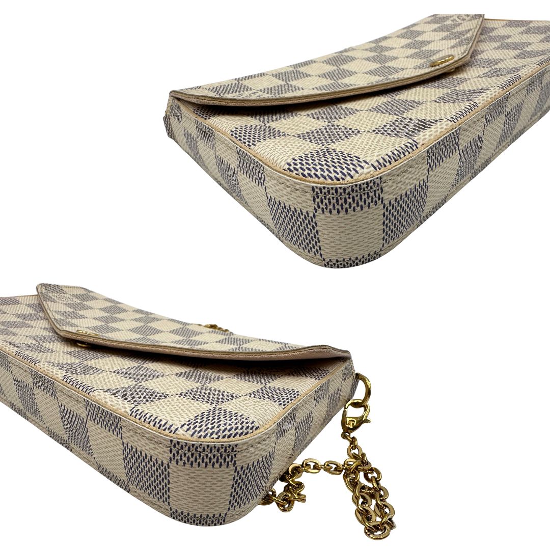 angoli Borsa L.V. in canvas Damier Azur rifinita con parti metalliche dorate; munita di una tracolla in catena amovibile, un portacarte e un portamonete