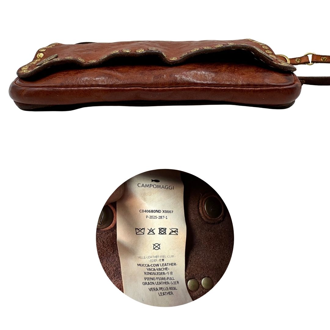 Borsa Campomaggi in cuoio impreziosita da borchie in metallo dorato e munita di una tracolla regolabile, e amovibile. Completa di dustbag e cartellino. Originale, usato, in condizioni eccellenti. 
