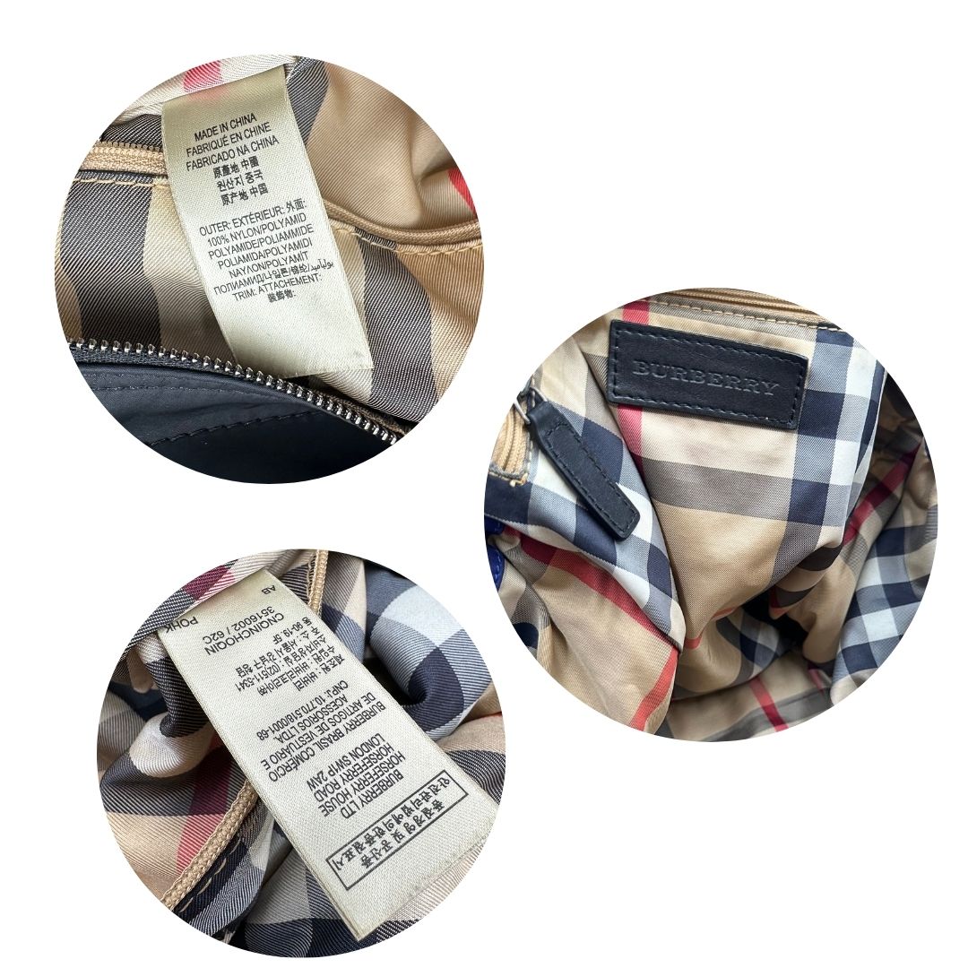 Borsa Burberry Tote Buckleigh in nylon viola con finiture in pelle nera e parti metalliche effetto renio. Munita di doppi manici, da indossare a spalla. Originale, usato, in condizioni ottime. 