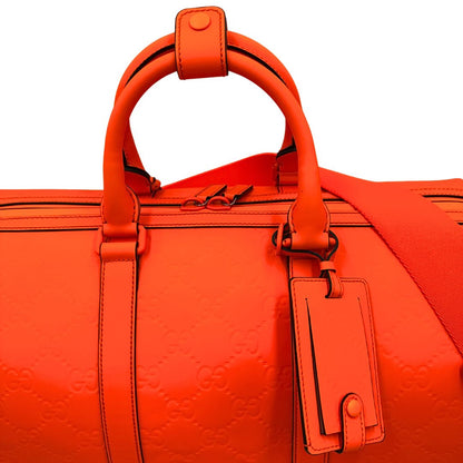 manici Borsone Gucci in pelle arancione fluo monogram; munito di doppi manici stondati e una tracolla regolabile in tessuto. Completo di dustbag. 