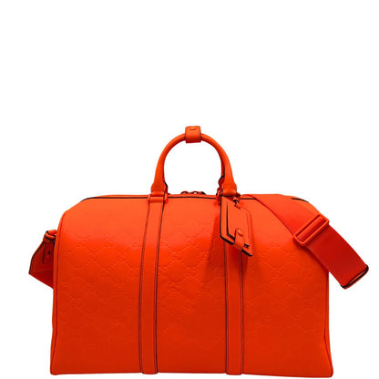 front Borsone Gucci in pelle arancione fluo monogram; munito di doppi manici stondati e una tracolla regolabile in tessuto. Completo di dustbag. 