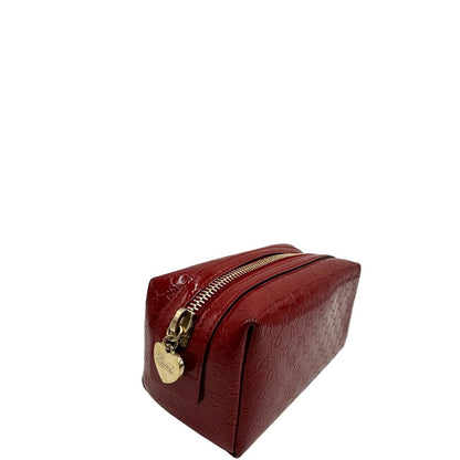 lato Pochette in pelle rossa verniciata monogram con parti metalliche dorate. Completa di dustbag, di lusso, originale, ottime condizioni 