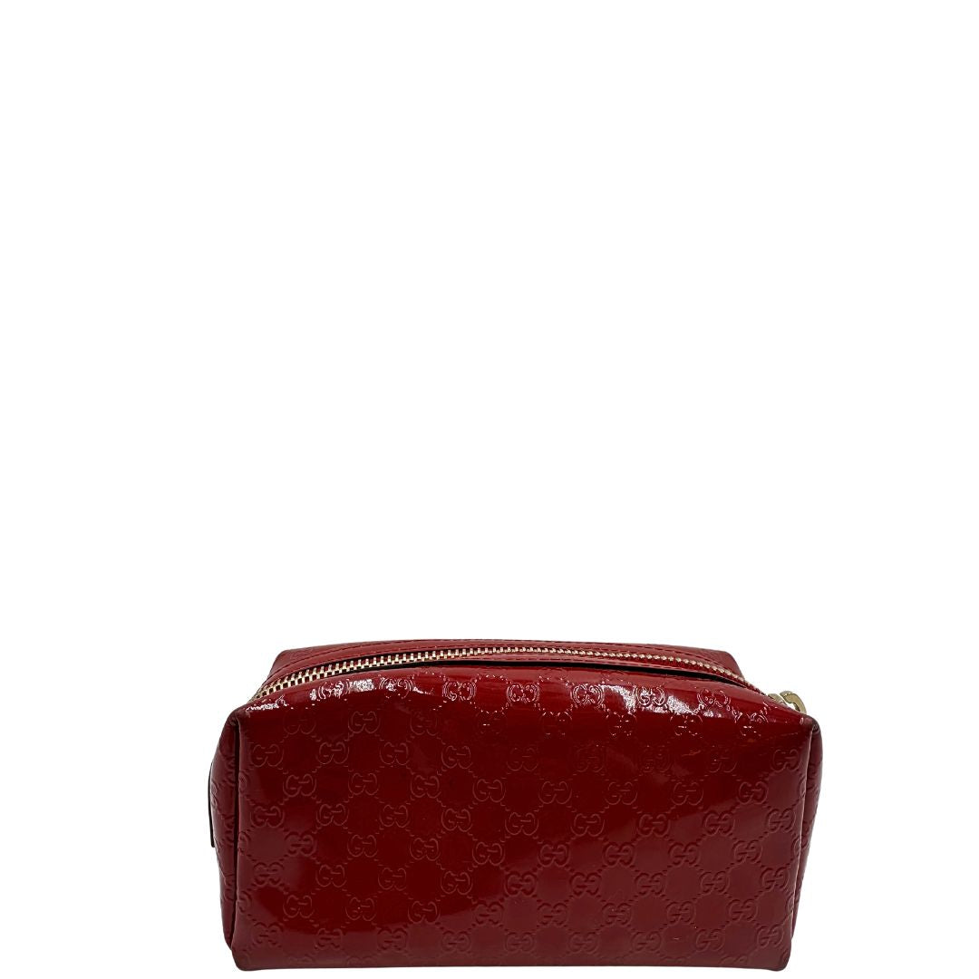 Pochette in pelle rossa verniciata monogram con parti metalliche dorate. Completa di dustbag, di lusso, originale, ottime condizioni