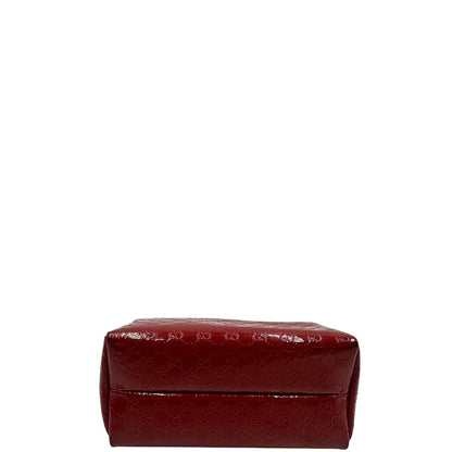 base Pochette in pelle rossa verniciata monogram con parti metalliche dorate. Completa di dustbag, di lusso, originale, ottime condizioni 