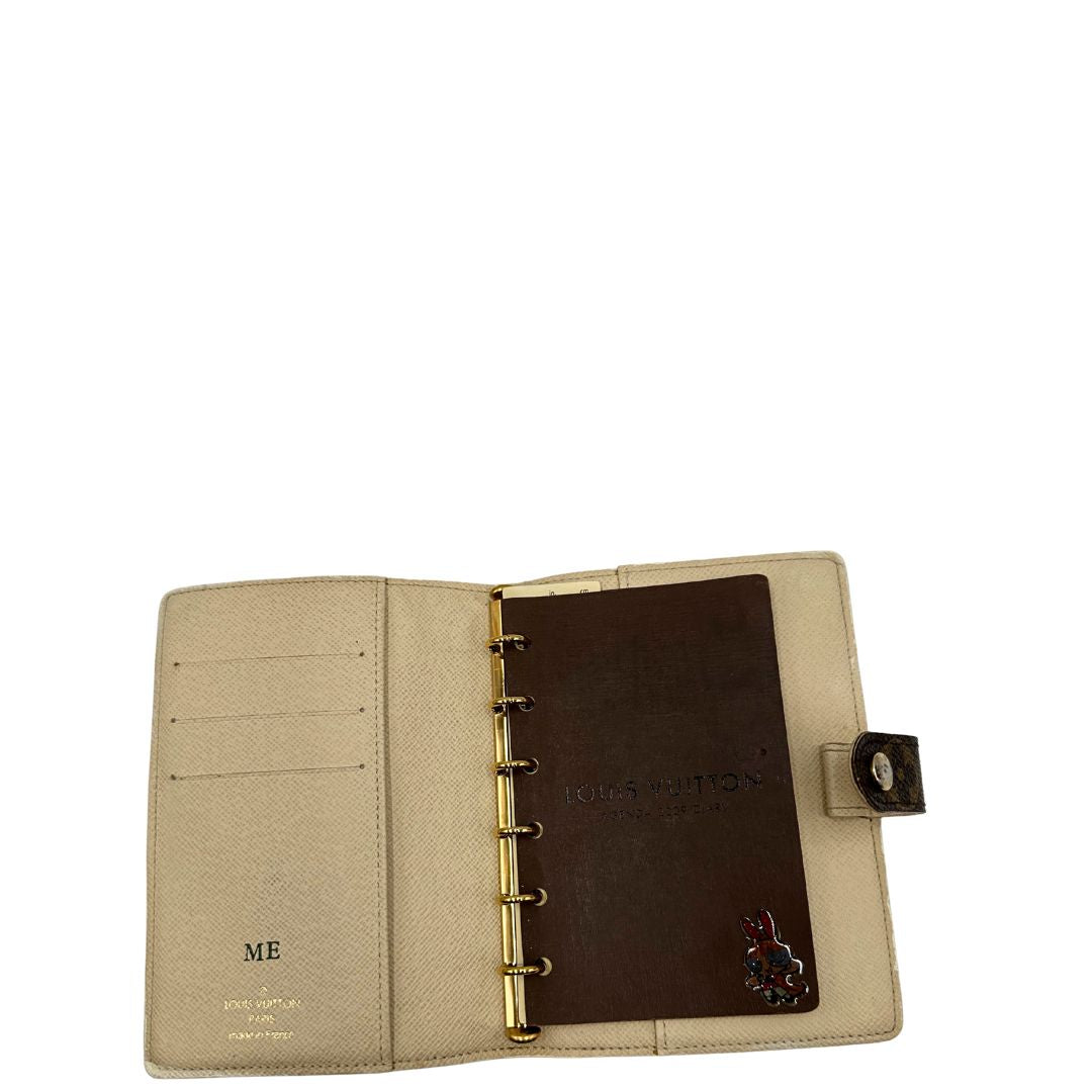 Porta agenda Louis Vuitton in tela monogram; chiusura a bottone in metallo dorato