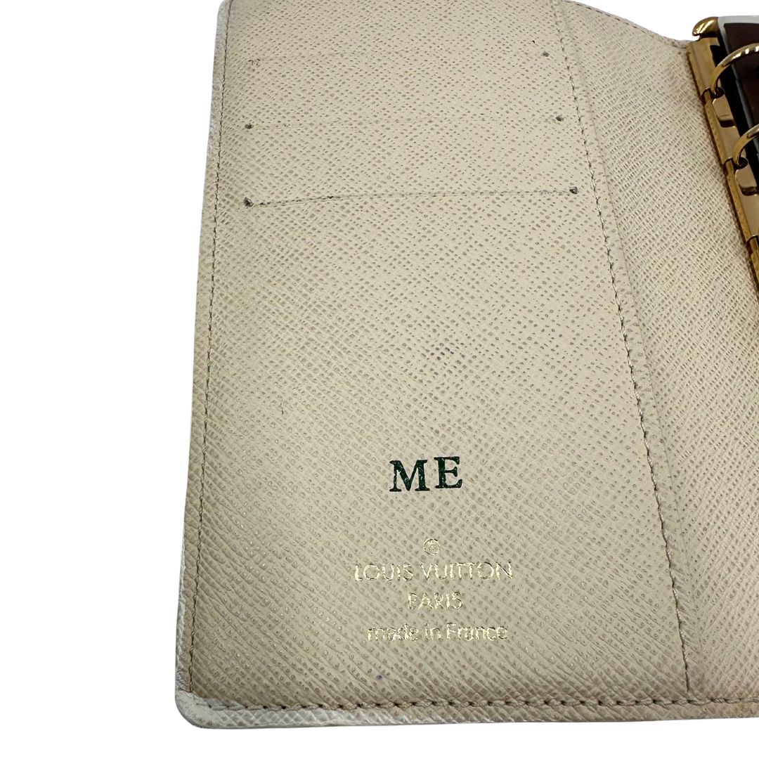 Porta agenda Louis Vuitton in tela monogram; chiusura a bottone in metallo dorato